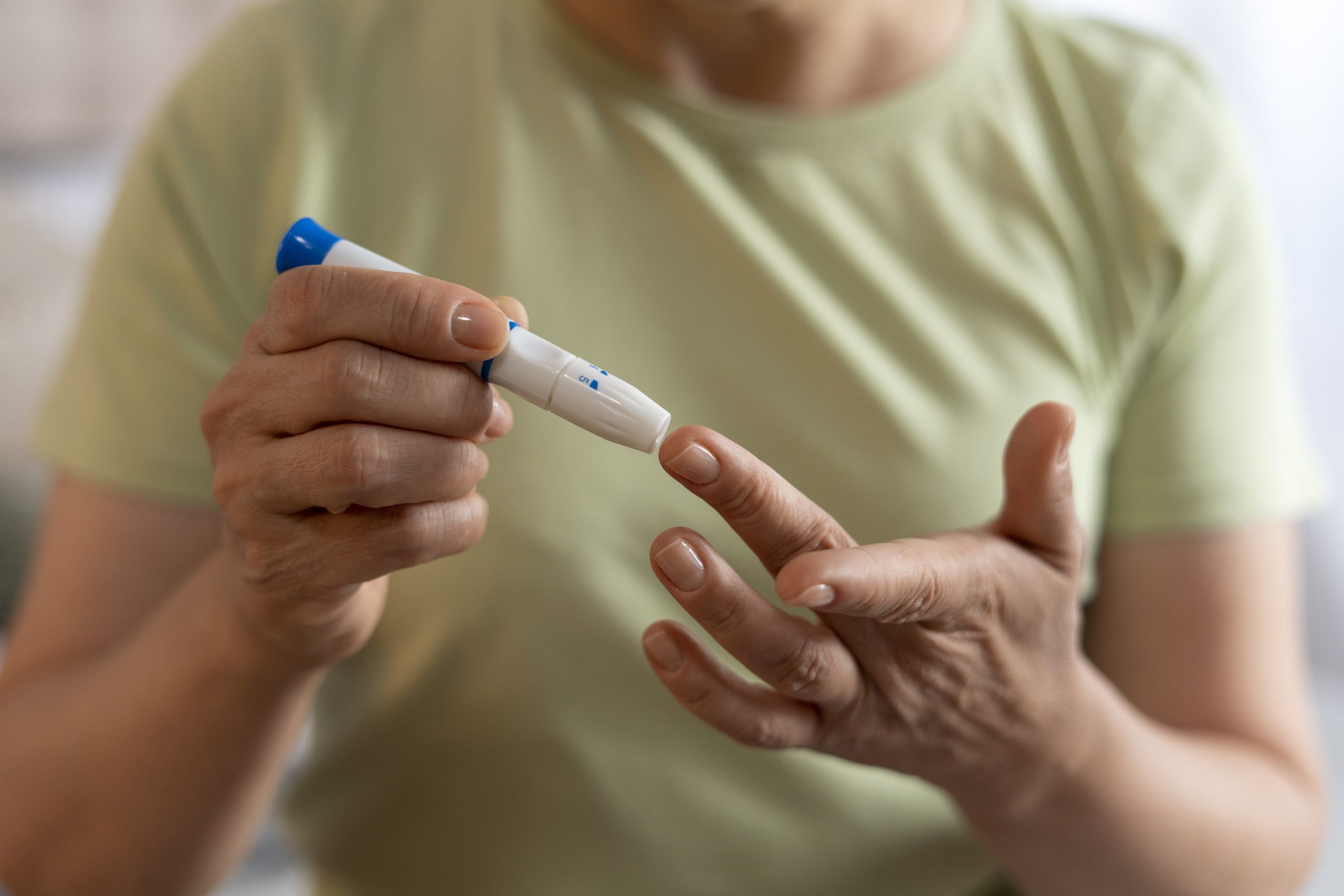 front view diabetic woman checking her glucose level